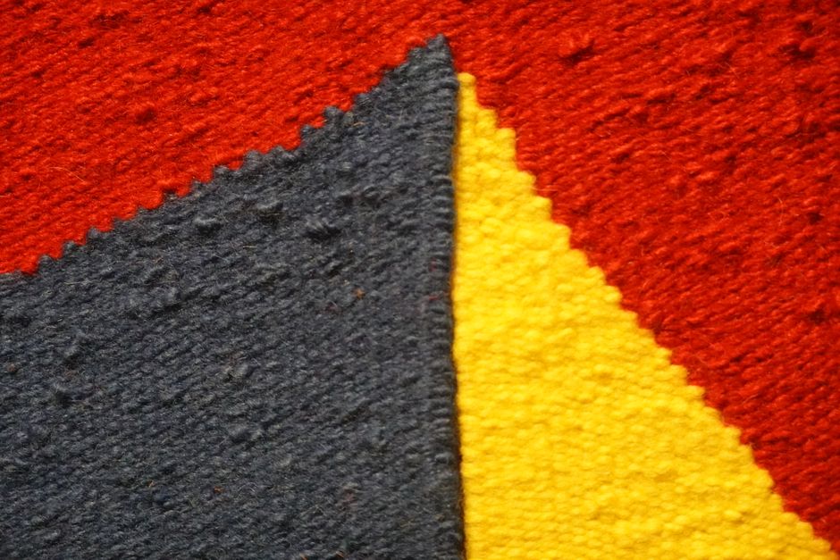 Textiel met trendy, bonte kaleidoscooppatronen. Textiel met trendy, bonte kaleidoscooppatronen.
